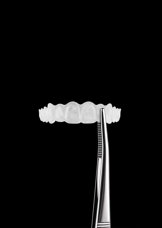 Pure PHA retainer held with tweezers