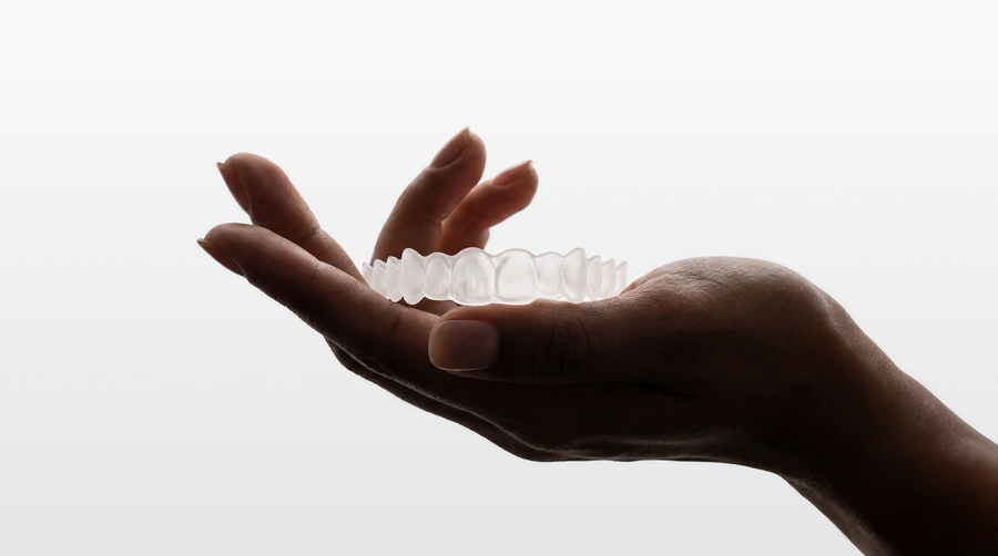 Clear moses retainer held in a hand